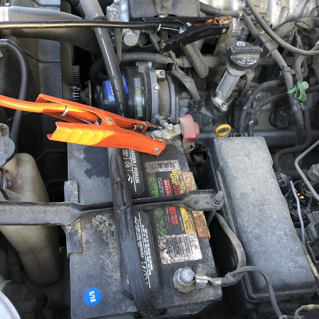 Jumper cables on dead battery for jump start safety